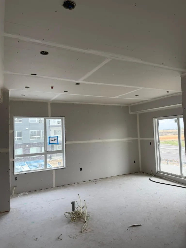 Interior room during taping with joint compound on wall seams